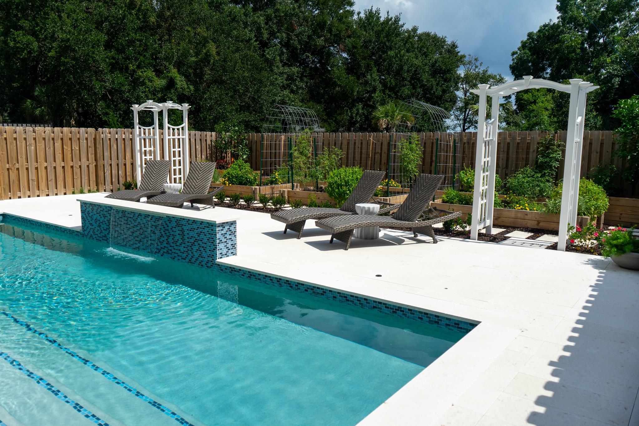 Crystal clear pool in a Lowcountry backyard on a summer afternoon